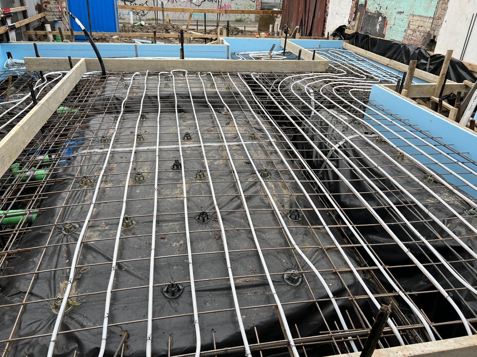 Uponor pipes tied to reo bars in slab